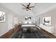 Digitally staged main bedroom featuring hardwood floors, neutral walls, and modern furniture and decor at 3017 Lana Ln, Marietta, GA 30066