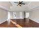 Spacious main bedroom with hardwood floors, tray ceiling, and ensuite access at 3017 Lana Ln, Marietta, GA 30066