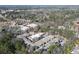 Scenic aerial view of the complex surrounded by trees near shopping and dining at 475 Mount Vernon Ne Hwy # A-102, Sandy Springs, GA 30328