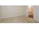 Bedroom with neutral carpet and a view to the bathroom at 475 Mount Vernon Ne Hwy # A-102, Sandy Springs, GA 30328