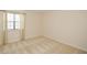 Bright bedroom with plush carpet and a window at 475 Mount Vernon Ne Hwy # A-102, Sandy Springs, GA 30328