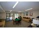 Inviting common room with comfortable seating, a table and chairs for games, and relaxing atmosphere at 475 Mount Vernon Ne Hwy # A-102, Sandy Springs, GA 30328