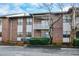 Brick multi-Gathering building with white accents, balconies, and tidy landscaping for a welcoming appearance at 475 Mount Vernon Ne Hwy # A-102, Sandy Springs, GA 30328