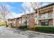 Multi-Gathering residential building with brick facade, balconies, manicured landscaping, and well-maintained exterior at 475 Mount Vernon Ne Hwy # A-102, Sandy Springs, GA 30328
