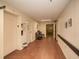 Hallway featuring an elevator on one side and a view down a long hallway with a sitting area at 475 Mount Vernon Ne Hwy # A-102, Sandy Springs, GA 30328