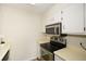 A well-equipped kitchen with updated stainless steel microwave and stove at 475 Mount Vernon Ne Hwy # A-102, Sandy Springs, GA 30328