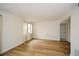 Inviting living room features a bright window and hardwood floors at 475 Mount Vernon Ne Hwy # A-102, Sandy Springs, GA 30328