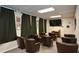 Cozy theater room with comfortable seating, a large screen, and movie posters for entertainment at 475 Mount Vernon Ne Hwy # A-102, Sandy Springs, GA 30328