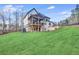 Spacious backyard featuring a large covered porch and beautifully maintained lawn at 603 Old Peachtree Ne Rd, Lawrenceville, GA 30043