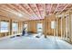Unfinished basement with concrete floor, framed walls, pink insulation, and windows, presenting a blank canvas for customization at 603 Old Peachtree Ne Rd, Lawrenceville, GA 30043