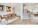 Open-concept floor plan shows dining room adjacent to staircase and living area at 603 Old Peachtree Ne Rd, Lawrenceville, GA 30043