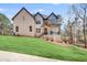 Charming two-story home with a welcoming front porch and lush green lawn at 603 Old Peachtree Ne Rd, Lawrenceville, GA 30043