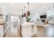 Modern kitchen with a large island and open to the living space at 603 Old Peachtree Ne Rd, Lawrenceville, GA 30043