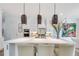 Gourmet kitchen with stainless steel appliances, large island, and pendant lighting at 603 Old Peachtree Ne Rd, Lawrenceville, GA 30043