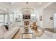 Open living room with coffered ceilings, fireplace, and stylish lighting at 603 Old Peachtree Ne Rd, Lawrenceville, GA 30043