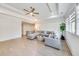 Bright living room features coffered ceiling, neutral color palette and large sectional sofa at 603 Old Peachtree Ne Rd, Lawrenceville, GA 30043