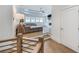 View from the stairs to the living room with built-ins and hardwood floors at 603 Old Peachtree Ne Rd, Lawrenceville, GA 30043