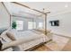 Spacious main bedroom featuring a decorative ceiling, television, and large windows at 603 Old Peachtree Ne Rd, Lawrenceville, GA 30043