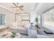 Bright and airy main bedroom featuring hardwood floors, sofa and large windows at 603 Old Peachtree Ne Rd, Lawrenceville, GA 30043