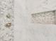 Close up of marble shower with river rock floor and built in soap niche at 603 Old Peachtree Ne Rd, Lawrenceville, GA 30043