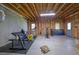 Unfinished basement with exposed ceiling, concrete floor, and exercise equipment at 1421 Hedgewood Nw Ln, Kennesaw, GA 30152