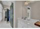Well-lit bathroom with a white vanity, tiled floor, and modern decor at 1421 Hedgewood Nw Ln, Kennesaw, GA 30152