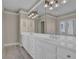 Bright bathroom featuring a double vanity, large mirror, and ample storage space for a luxurious experience at 1421 Hedgewood Nw Ln, Kennesaw, GA 30152