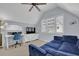Comfortable bedroom features a modern work-from-home space, blue couch, and natural light from multiple windows at 1421 Hedgewood Nw Ln, Kennesaw, GA 30152