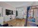 Cozy bedroom with hardwood floors, large windows, and a bunk bed with whimsical decor at 1421 Hedgewood Nw Ln, Kennesaw, GA 30152