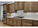 Gourmet kitchen featuring marble countertops, subway tile backsplash, and custom wood cabinetry at 1421 Hedgewood Nw Ln, Kennesaw, GA 30152