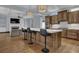 Spacious kitchen with an island, barstool seating, modern appliances, and a seamless transition to the living area at 1421 Hedgewood Nw Ln, Kennesaw, GA 30152