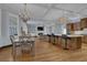 Open kitchen with a large island, pendant lighting, modern appliances, and views into the living space at 1421 Hedgewood Nw Ln, Kennesaw, GA 30152