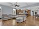 Open-concept living space with hardwood floors, coffered ceilings, and seamless flow to the kitchen at 1421 Hedgewood Nw Ln, Kennesaw, GA 30152