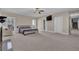 Expansive main bedroom featuring a fireplace, large windows, and access to a hallway with staircase at 1421 Hedgewood Nw Ln, Kennesaw, GA 30152