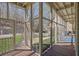 Relaxing screened-in porch with wooded views, ideal for outdoor entertaining at 1421 Hedgewood Nw Ln, Kennesaw, GA 30152