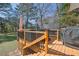 Multi-level back deck features a grill, hot tub, and ample space for outdoor lounging at 2613 Travois Sw Way, Lilburn, GA 30047