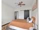 Cozy bedroom features a ceiling fan, a barn door and a bed with a light colored headboard at 3060 Pharr Court North Nw # 619, Atlanta, GA 30305