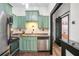 Modern kitchen with stainless steel appliances, and adjacent bedroom view at 3060 Pharr Court North Nw # 619, Atlanta, GA 30305