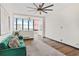 Stylish living room features a green sofa, hardwood floors, and city views at 3060 Pharr Court North Nw # 619, Atlanta, GA 30305
