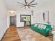 Living room with a cozy green sofa, adjacent to the kitchen area at 3060 Pharr Court North Nw # 619, Atlanta, GA 30305