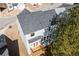 Aerial view of home showcasing the new roof and wooden deck and surrounding trees at 3200 Tackett Rd, Douglasville, GA 30135