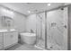 Bathroom featuring soaker tub, glass enclosed shower, double sinks and modern fixtures at 3200 Tackett Rd, Douglasville, GA 30135