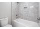 A modern bathroom with tile shower, and built in niche for storage at 3200 Tackett Rd, Douglasville, GA 30135