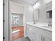This bathroom features a double vanity, white cabinets, and sleek design at 3200 Tackett Rd, Douglasville, GA 30135