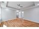 Bright bedroom with hardwood floors, ceiling fan, recessed lights, and an ensuite bathroom at 3200 Tackett Rd, Douglasville, GA 30135