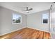 A brightly lit bedroom with ceiling fan and access door at 3200 Tackett Rd, Douglasville, GA 30135