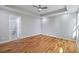 Bedroom featuring hardwood floors, recessed lights, ceiling fan, and a bathroom at 3200 Tackett Rd, Douglasville, GA 30135