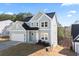 Charming two-story home with a two car garage and attractive siding at 3200 Tackett Rd, Douglasville, GA 30135