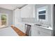Bright kitchen with stainless steel appliances, a double sink, and door to deck at 3200 Tackett Rd, Douglasville, GA 30135
