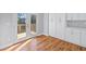 Bright eat-in kitchen featuring white cabinets and door to deck at 3200 Tackett Rd, Douglasville, GA 30135